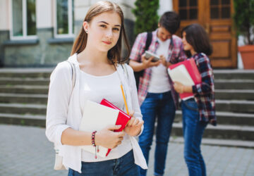 young-student-posing-near-university